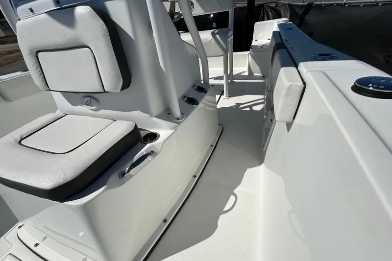 Slide: The Image of 2020 Clearwater 2000 Center Console boat interior with cushioned seating and console details. - 27