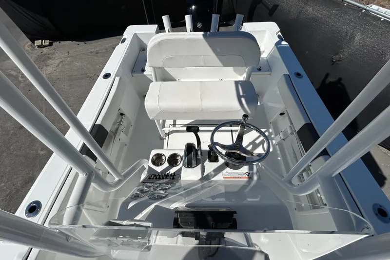Slide: The Image of 2020 Clearwater 2000 Center Console boat interior with steering wheel and seating. - 28