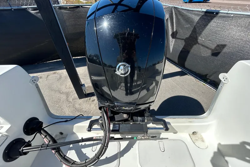 Slide: The Image of 2020 Clearwater 2000 Center Console boat engine, black, parked outdoors. - 31