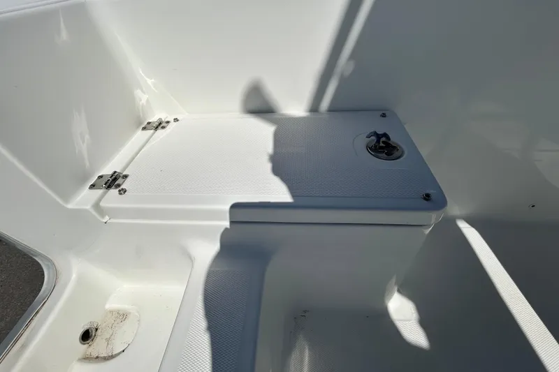 Slide: The Image of 2020 Clearwater 2000 Center Console boat interior with storage compartment. - 32