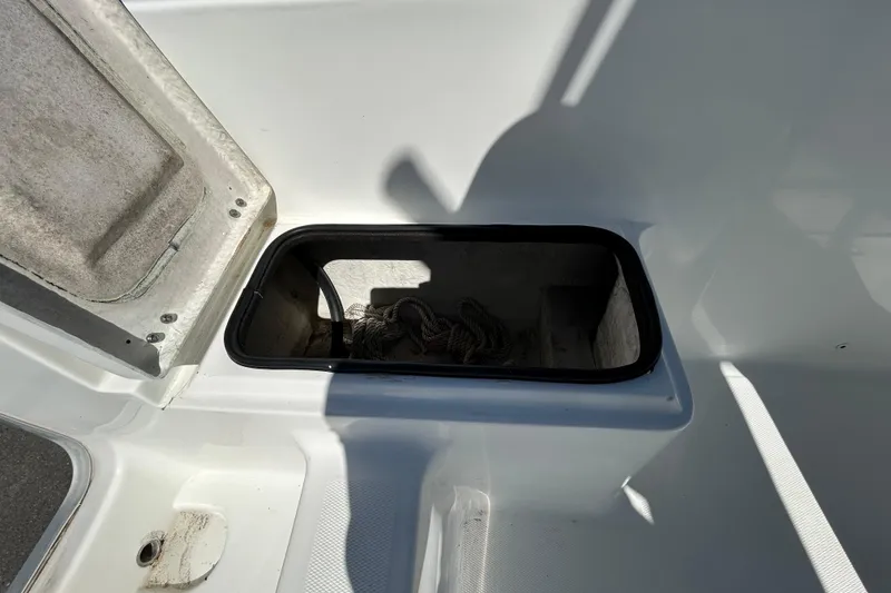 Slide: The Image of Open storage compartment on 2020 Clearwater 2000 Center Console boat. - 33