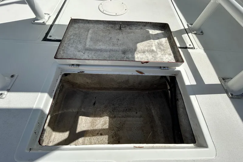 Slide: The Image of Open storage compartment on 2020 Clearwater 2000 Center Console boat deck. - 40