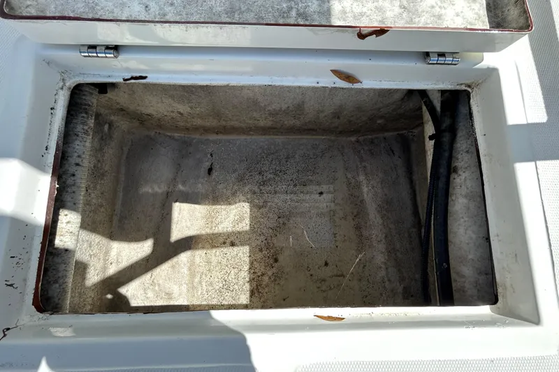 Slide: The Image of Open storage compartment on 2020 Clearwater 2000 Center Console boat. - 41