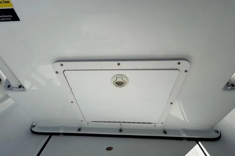 Slide: The Image of Hatch on 2020 Clearwater 2000 Center Console boat, featuring secure latch and sleek design. - 42