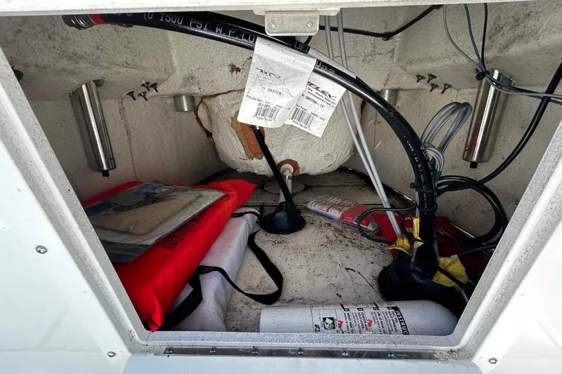 Slide: The Image of Storage compartment of 2020 Clearwater 2000 Center Console boat with safety equipment. - 44
