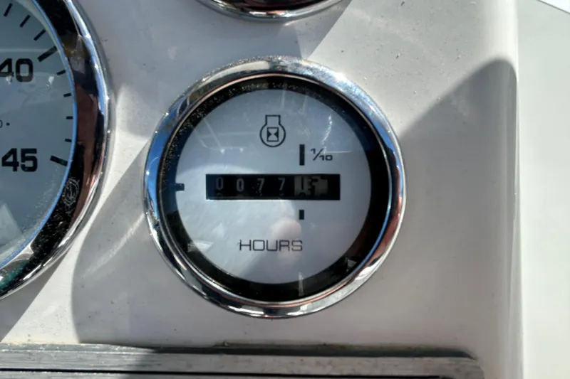 Slide: The Image of Hour meter on 2020 Clearwater 2000 Center Console boat, displaying 77.1 hours. - 46