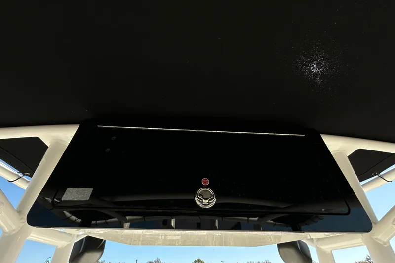 Slide: The Image of 2020 Clearwater 2000 Center Console boat dashboard, featuring sleek black design and modern controls. - 47