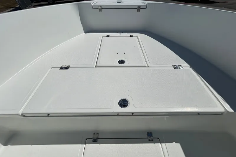 Slide: The Image of Clearwater 2000 Center Console boat deck, 2020 model, featuring storage compartments. - 54