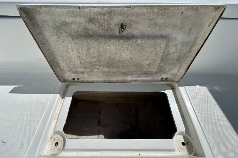 Slide: The Image of Open storage compartment on 2020 Clearwater 2000 Center Console boat. - 57