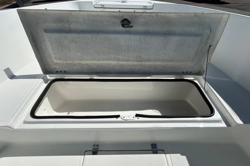 Slide: The Image of Open storage compartment on 2020 Clearwater 2000 Center Console boat. - 59