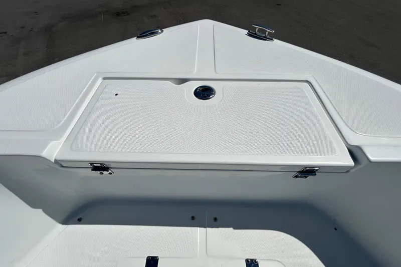 Slide: The Image of Bow of 2020 Clearwater 2000 Center Console boat with storage compartment. - 64