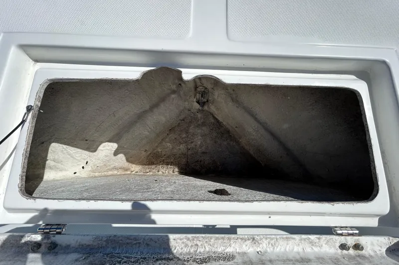 Slide: The Image of Open storage compartment on 2020 Clearwater 2000 Center Console boat. - 66