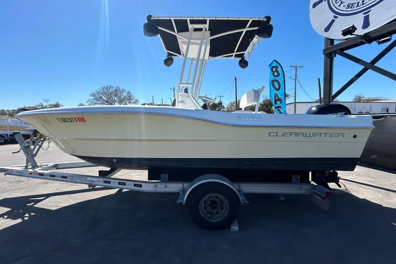 Slide: The Image of 2020 Clearwater 2000 Center Console boat on trailer, sunny day, outdoor display. - 7