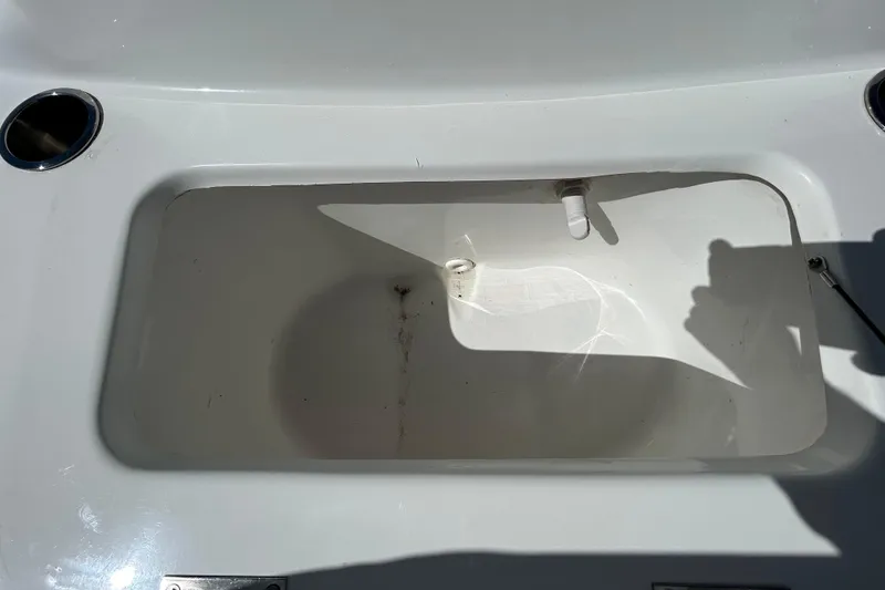 Slide: The Image of Open storage compartment on 2020 Clearwater 2000 Center Console boat. - 74
