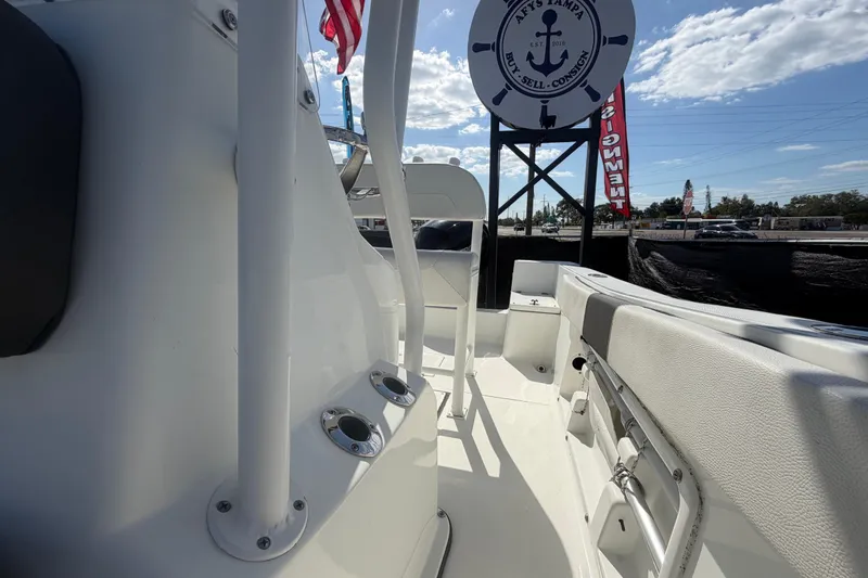 Slide: The Image of 2020 Clearwater 2000 Center Console boat interior with seating and rod holders. - 79