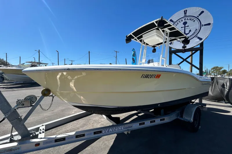 Slide: The Image of 2020 Clearwater 2000 Center Console boat on trailer under clear blue sky. - 8