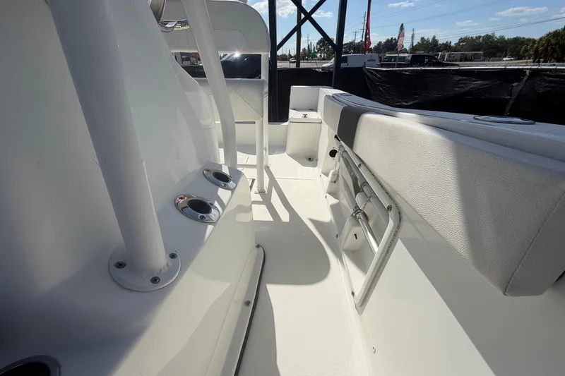Slide: The Image of 2020 Clearwater 2000 Center Console boat interior with seating and rod holders. - 80