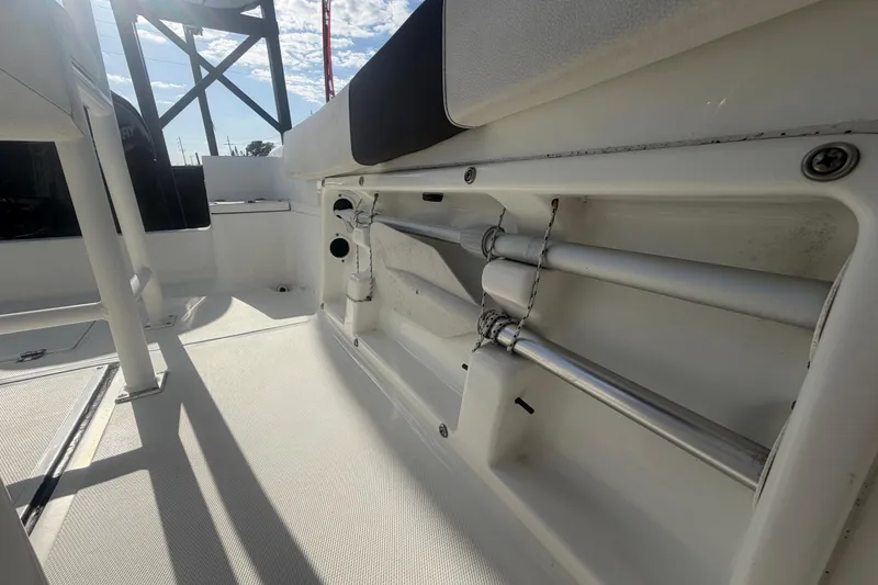 Slide: The Image of 2020 Clearwater 2000 Center Console boat interior with storage compartment and seating. - 81
