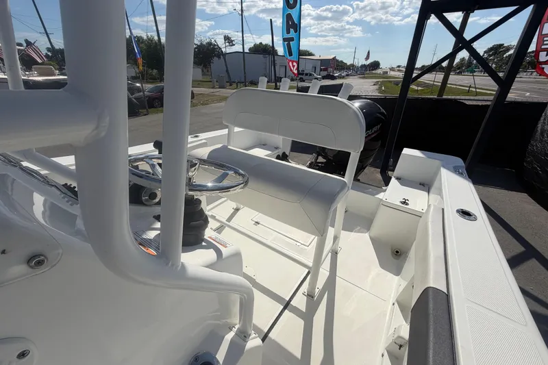 Slide: The Image of 2020 Clearwater 2000 Center Console boat interior with steering wheel and seating. - 82