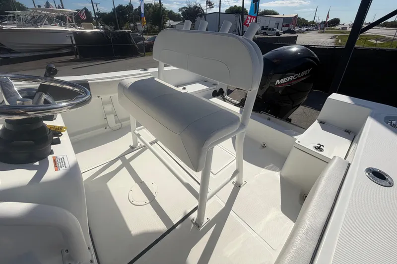 Slide: The Image of 2020 Clearwater 2000 Center Console boat interior with steering wheel and Mercury engine. - 84