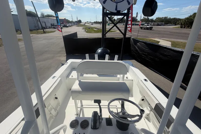 Slide: The Image of 2020 Clearwater 2000 Center Console boat interior with steering wheel and seating. - 85