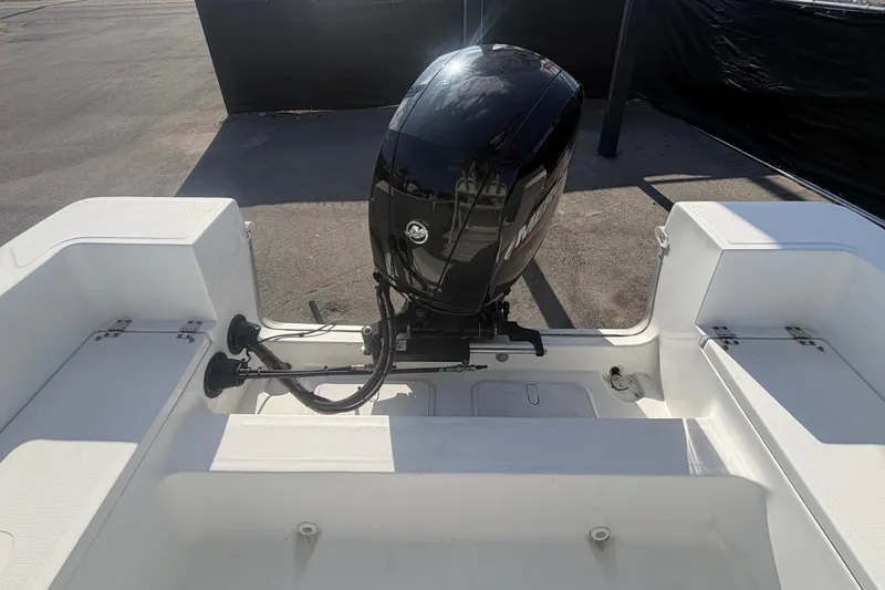 Slide: The Image of 2020 Clearwater 2000 Center Console boat with powerful outboard motor, rear view. - 93
