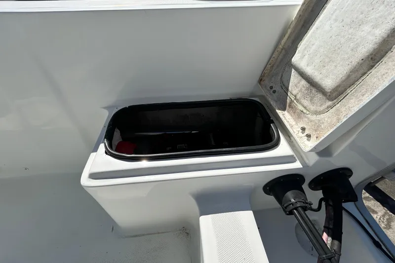 Slide: The Image of Open storage compartment on 2020 Clearwater 2000 Center Console boat. - 95