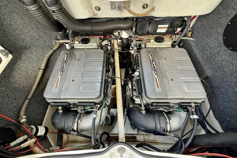 Slide: The Image of Twin engines of a 2010 Yamaha Boats 212X, showcasing detailed components. - 9