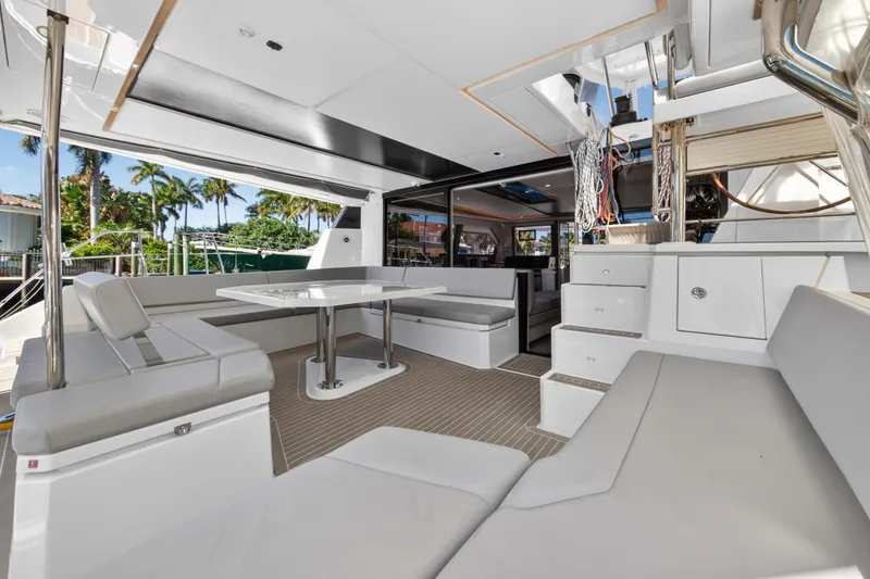 Slide: The Image of Luxurious 2021 Leopard 50 yacht interior with modern seating and dining area. - 10