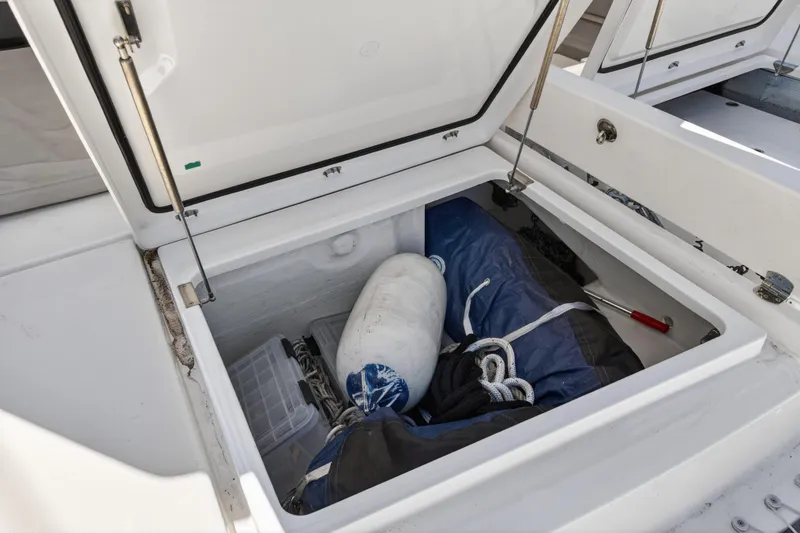 Slide: The Image of Open storage compartment on 2021 Leopard 50 yacht with marine equipment inside. - 106