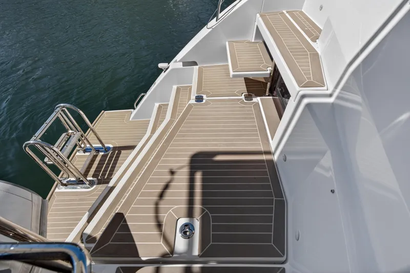 Slide: The Image of Leopard 50 yacht deck with ladder, 2021 model, featuring sleek design and water access. - 113