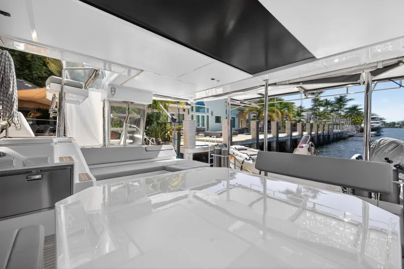 Slide: The Image of Luxurious 2021 Leopard 50 yacht interior with waterfront view and modern seating area. - 25