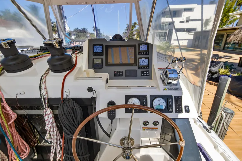 Slide: The Image of Helm of 2021 Leopard 50 yacht with navigation instruments and steering wheel. - 33