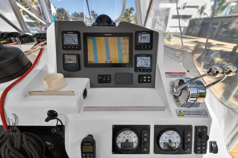 Slide: The Image of Control panel of a 2021 Leopard 50 yacht with navigation instruments and throttle levers. - 34