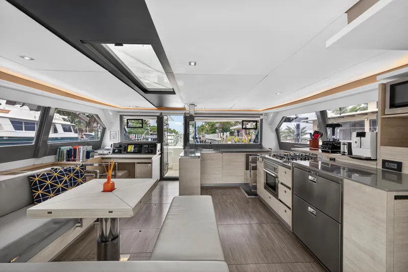 Slide: The Image of Luxurious interior of a 2021 Leopard 50 yacht featuring modern kitchen and seating area. - 50