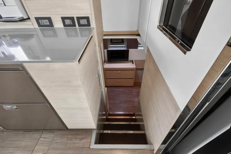 Slide: The Image of Modern interior of 2021 Leopard 50 yacht with sleek kitchen and stairs. - 59