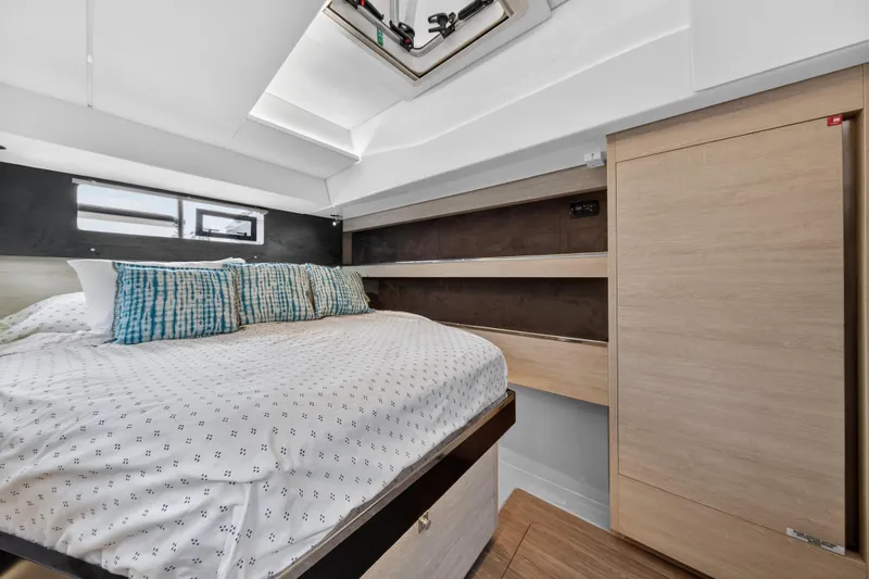Slide: The Image of Modern bedroom interior in 2021 Leopard 50 yacht with skylight and stylish bedding. - 61