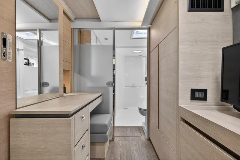 Slide: The Image of Modern interior of 2021 Leopard 50 yacht with sleek wood finishes and compact design. - 68