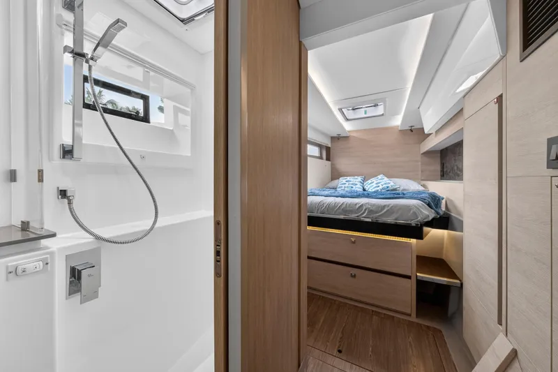 Slide: The Image of Modern Leopard 50 yacht interior with bedroom and bathroom, featuring sleek design and wood finishes. - 77