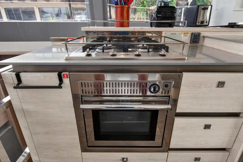 Slide: The Image of Modern kitchen with stainless steel oven and stovetop on Leopard 50 yacht, 2021 model. - 94