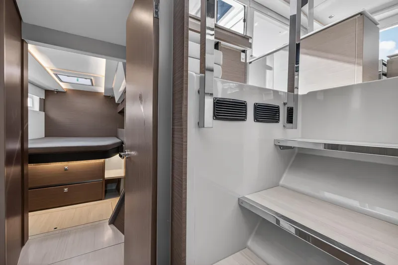 Slide: The Image of Interior of 2022 Leopard 50 yacht featuring modern cabin and sleek staircase design. - 130