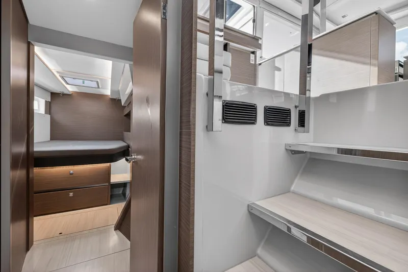 Slide: The Image of Interior of 2022 Leopard 50 yacht, featuring modern cabin and sleek staircase design. - 131