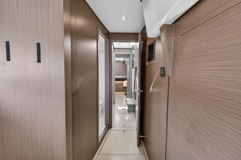 Slide: The Image of Modern interior hallway of 2022 Leopard 50 yacht with wood paneling. - 137