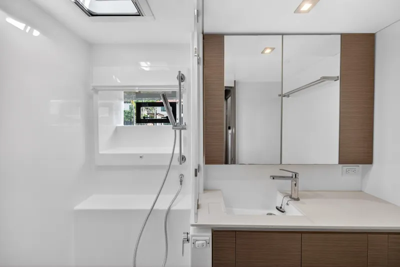 Slide: The Image of Modern bathroom interior on Leopard 50 yacht, featuring sleek fixtures and mirrored cabinets, 2022 model. - 139