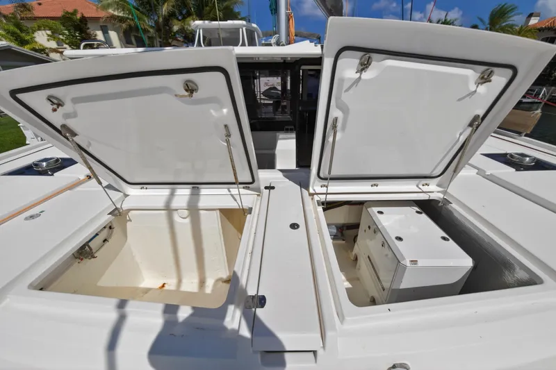 Slide: The Image of Open storage compartments on a 2022 Leopard 50 yacht deck, showcasing spacious interior. - 140