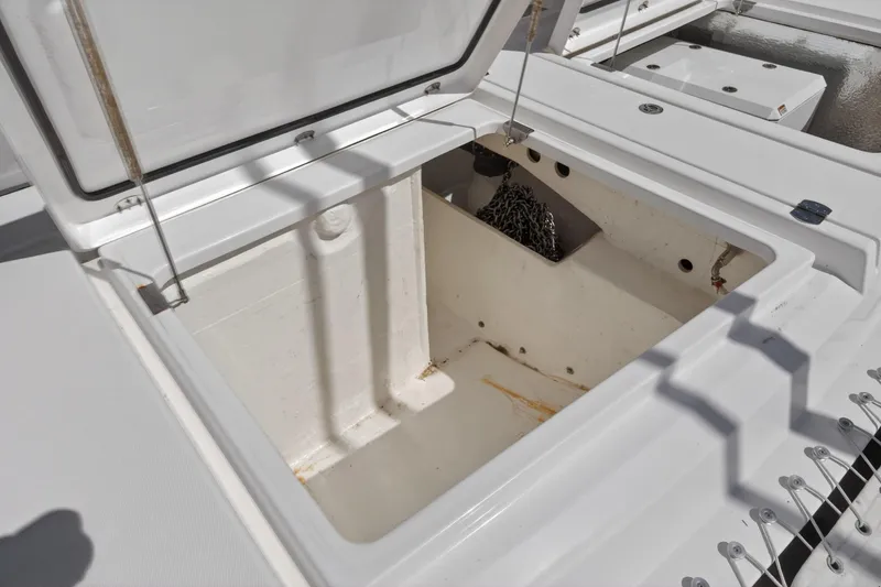 Slide: The Image of Open storage compartment on a 2022 Leopard 50 yacht, showcasing interior space and anchor chain. - 142