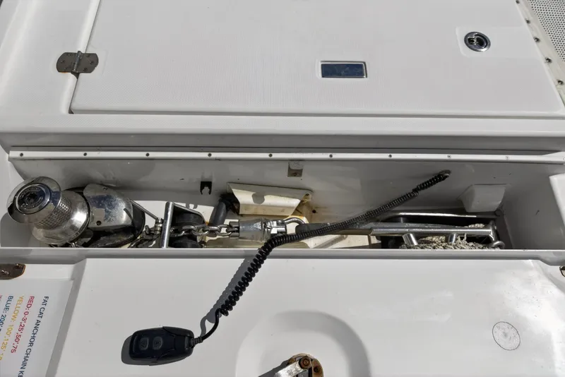 Slide: The Image of Anchor compartment of a 2022 Leopard 50 yacht, featuring winch and chain storage. - 143