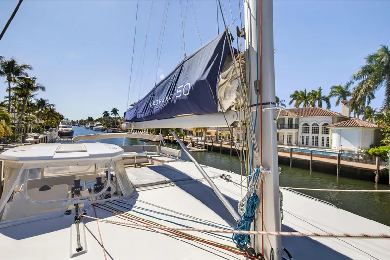 Slide: The Image of Back view from a 2022 Leopard 50 yacht docked in a sunny marina. - 18