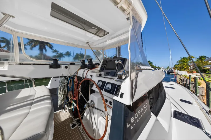 Slide: The Image of Control panel of a 2022 Leopard 50 yacht with navigation displays and throttle lever. - 31