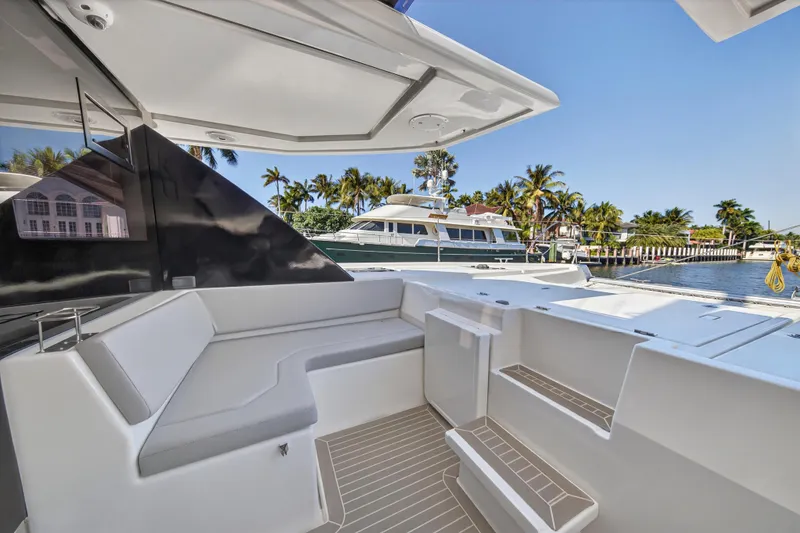 Slide: The Image of Modern Leopard 50 yacht interior, 2022 model, featuring sleek seating and glass door. - 46